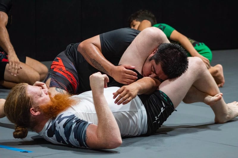 An athlete taking the back during no-gi sparring