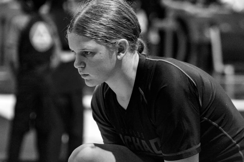 Black-and-white portrait of a teen competitor waiting for her match to start.